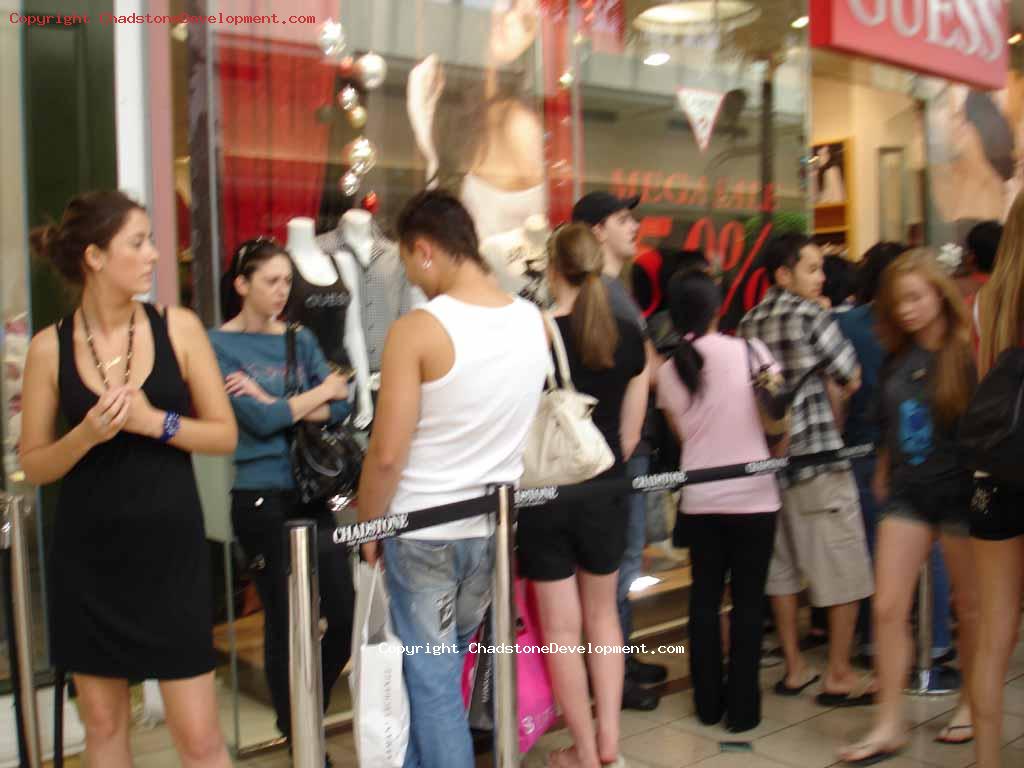 Waiting in line to enter a store - Chadstone Development Discussions
