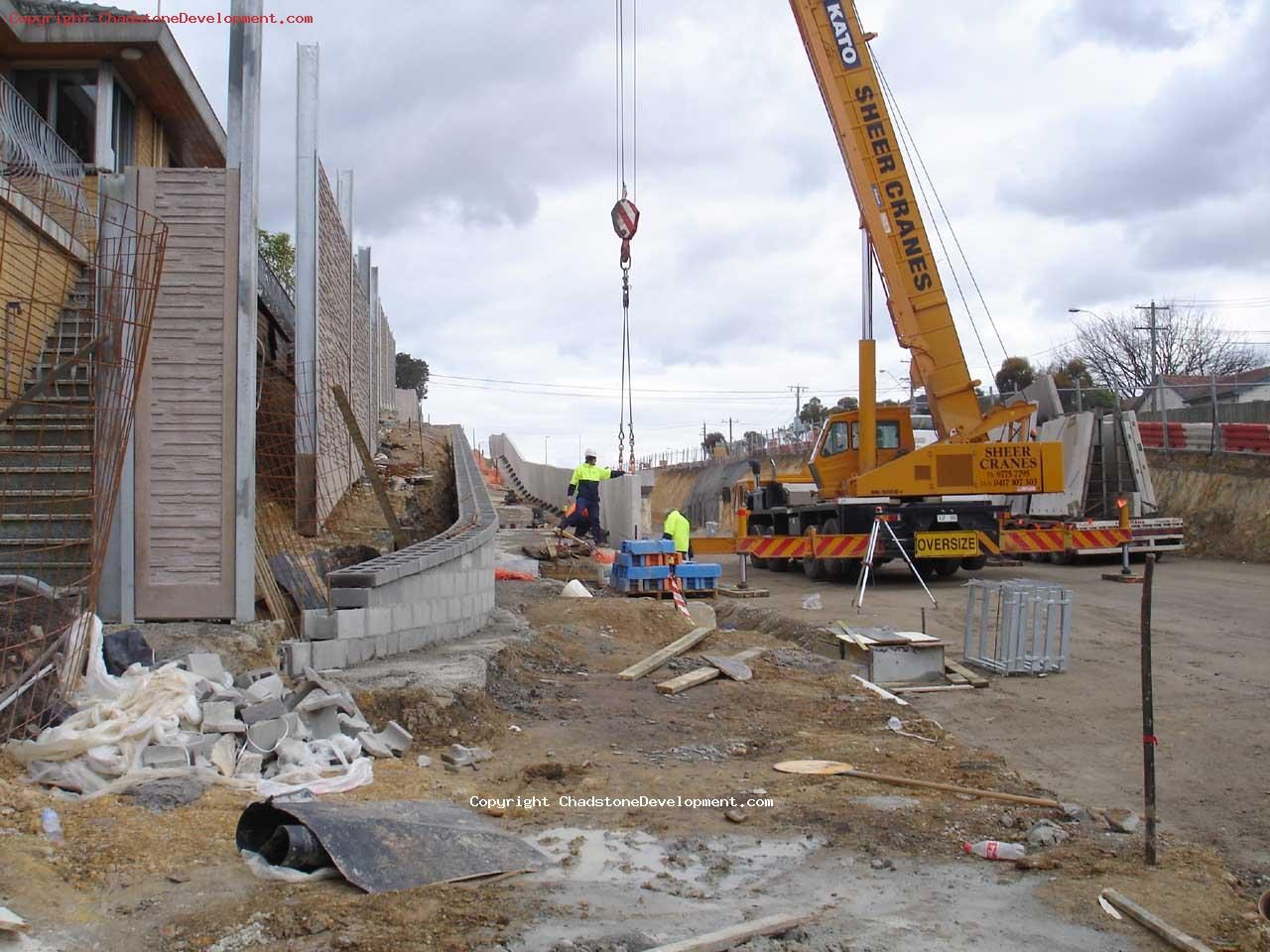 Errecting the barrier wall along the walkway - Chadstone Development Discussions