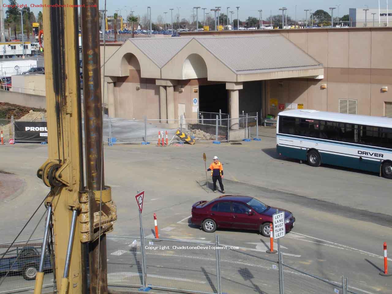 Lolipop man directing traffic around the fated roundabout - Chadstone Development Discussions