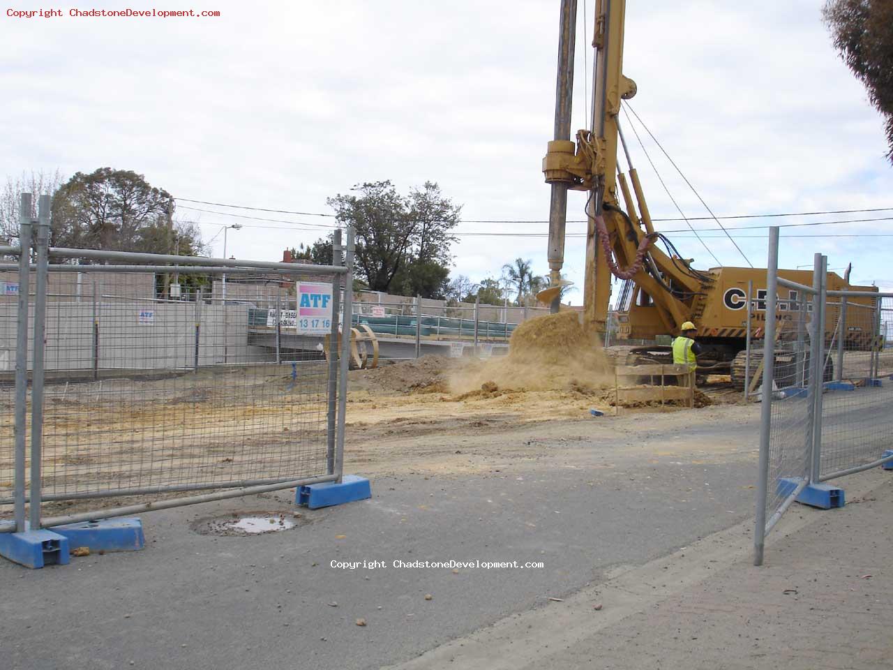 Piling machine drills up dirt - Chadstone Development Discussions