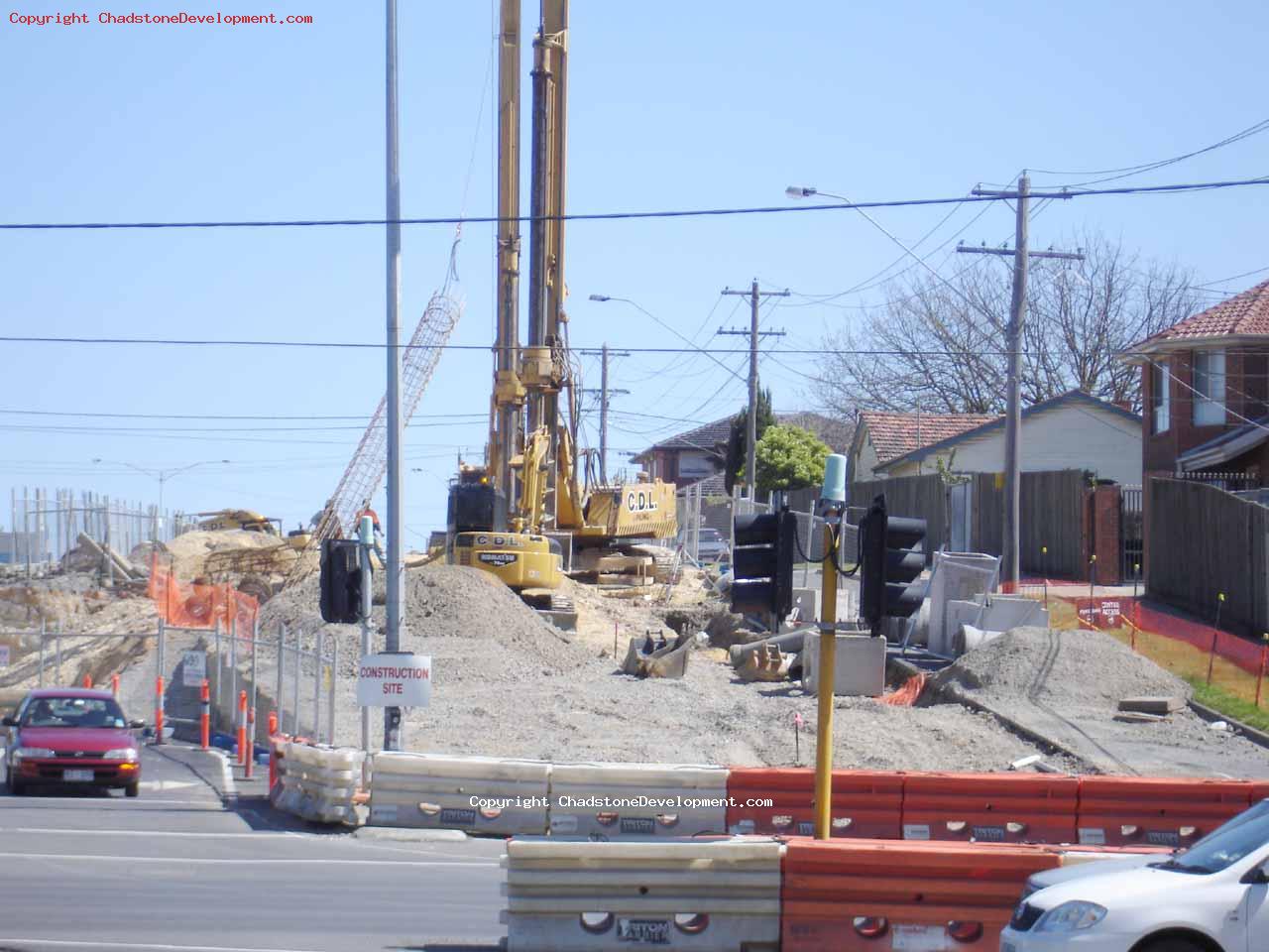 Piling machine lifts a wire mesh cylinder - Chadstone Development Discussions