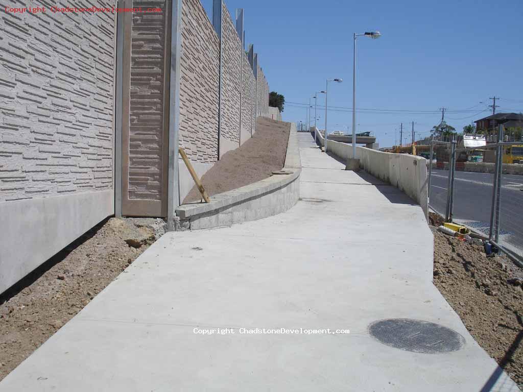 Soil on the footpath embankment, ready for foliage - Chadstone Development Discussions